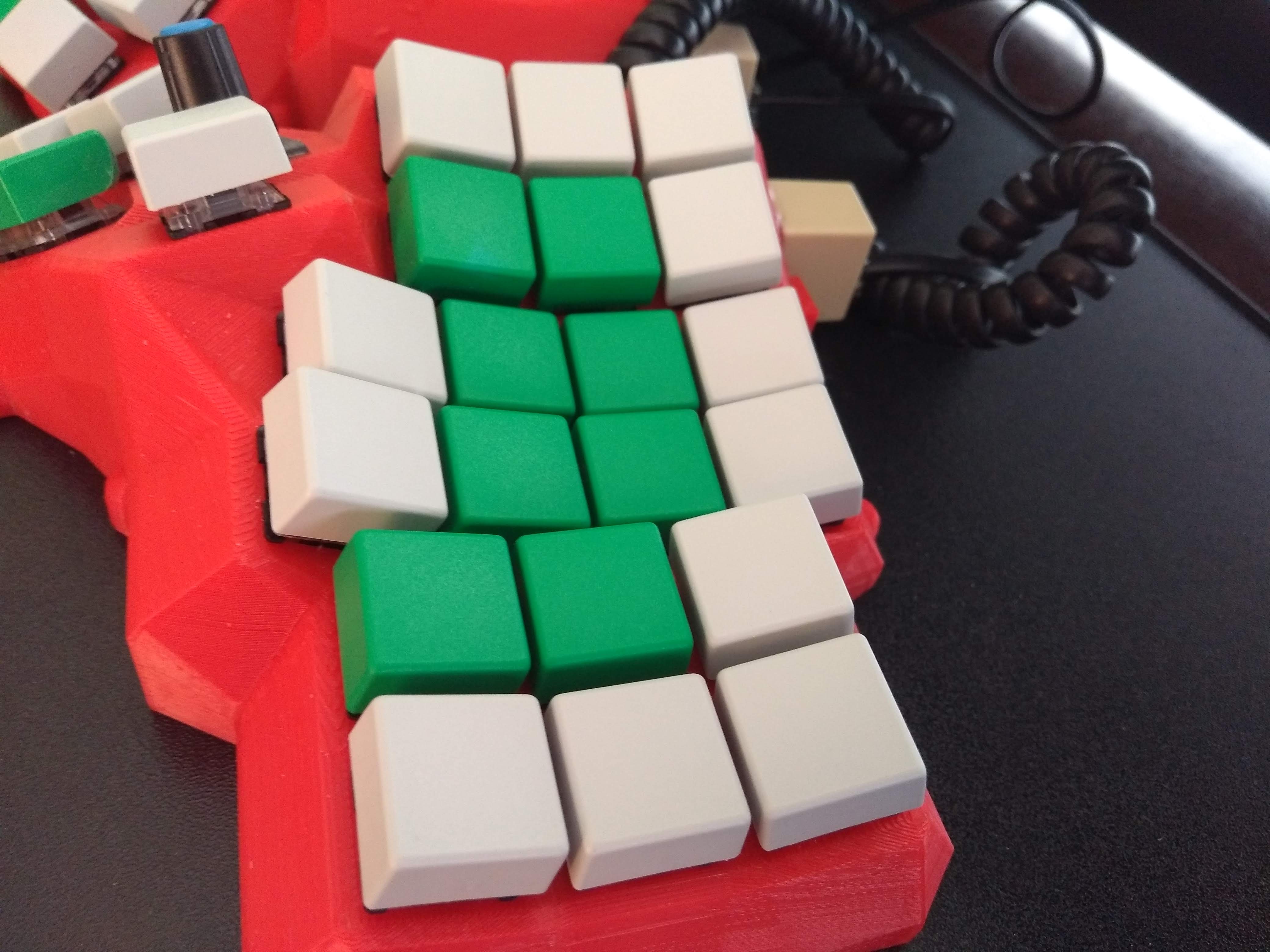 Dactyl Manuform 3D printed case halves showing ergonomic shape